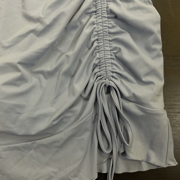 Halara High Waisted Ruched Asymmetric Hem 2-in-1 Side Pocket Mini Yoga Skirt - Picture 3 of 4